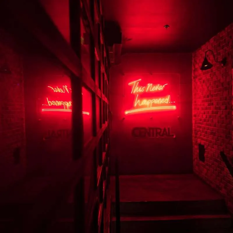 dark branding room with red neon light telling people to select the best branding company in bahrain
