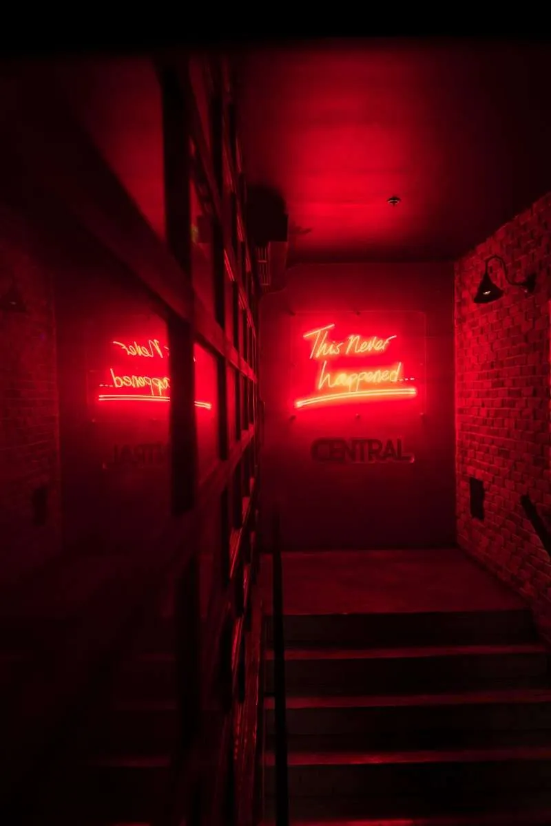 dark branding room with red neon light telling people to select the best branding company in bahrain