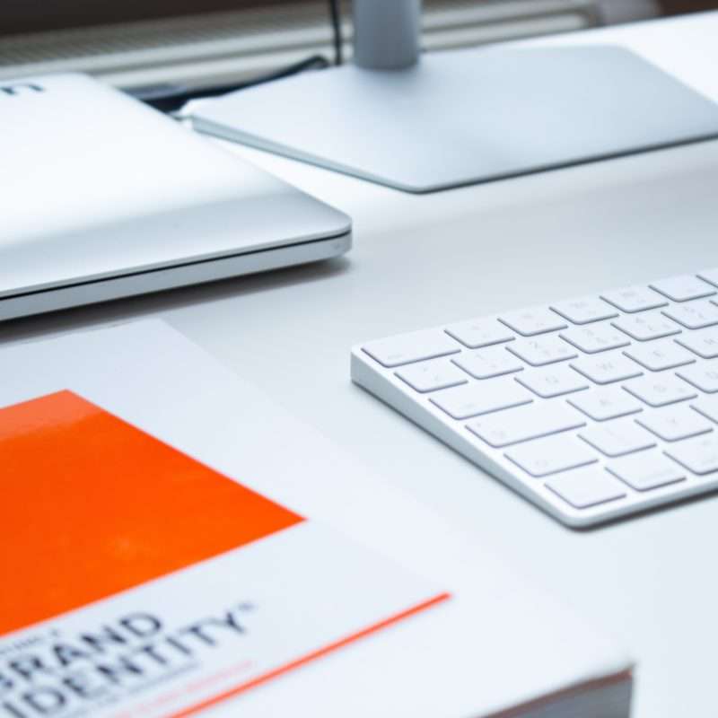 branding business card with apple products on the table